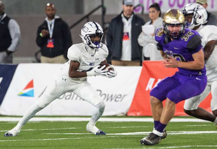 Clay-Chalkville's Mario Craver (4) turns up field after a catch during the Class 6A football state championship at Protective Stadium in Birmingham, Ala., on Friday, Dec. 3, 2021.